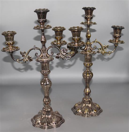 A pair of plated two branch, three light candelabra, H40.5 cms